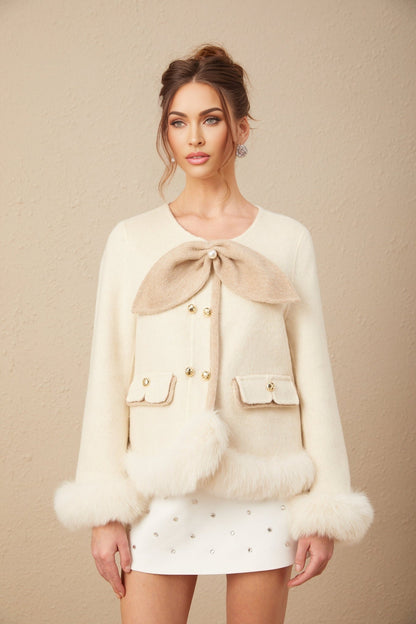 A stylish short coat featuring a twotone design and a decorative bowknot detail named Théophila
