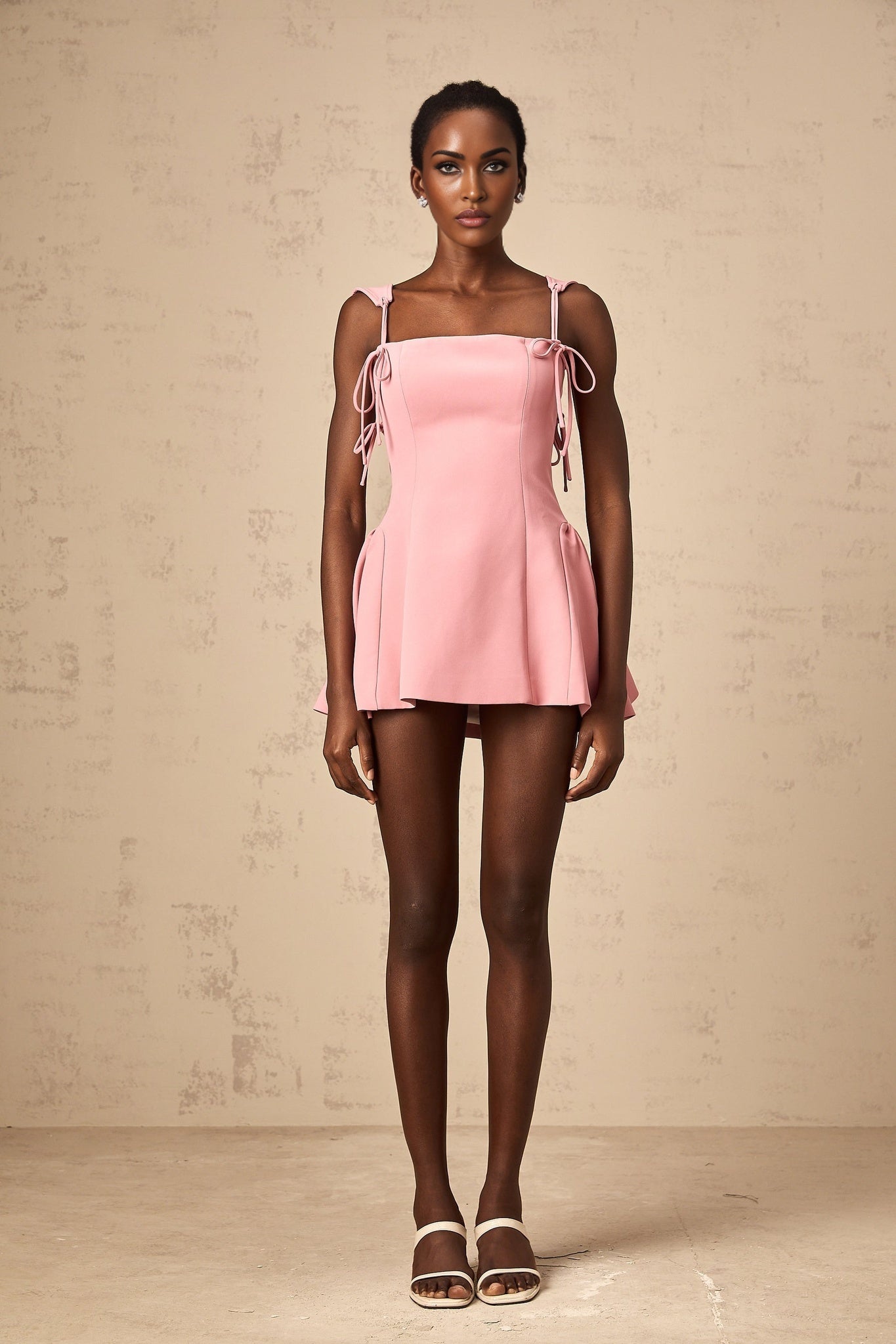 Pink mini dress with puff sleeves and detachable strap by Donatienne