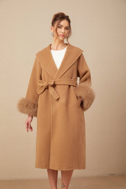 A long brown woolen overcoat with a felted texture and wrap style design