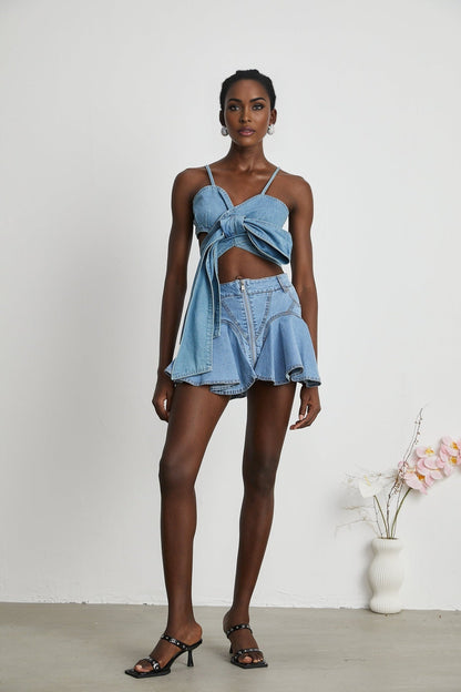 A denim skirt with a ruffled hem named Capucine featuring a volant or flounced bottom edge