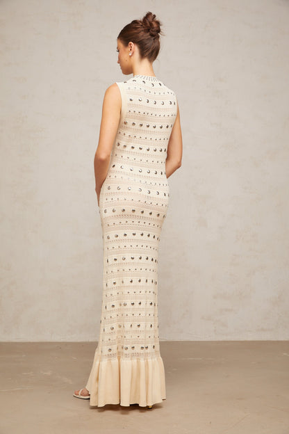Neutral colored long crochet knit maxi dress with studded details by Chloe