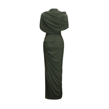 A woman wearing a long green asymmetric pleated maxi dress with a flowy skirt and one shoulder design