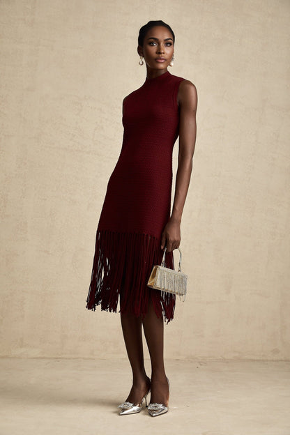 A red knitted midi dress with fringe details designed by Celine