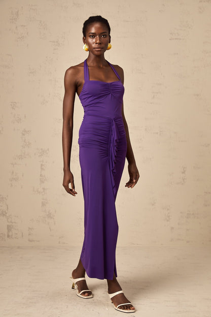 A purple midi dress with a halterneck design and ruched detailing called the Renata