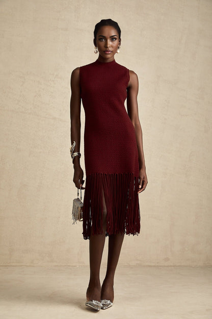 A red knitted midi dress by Celine with fringe details