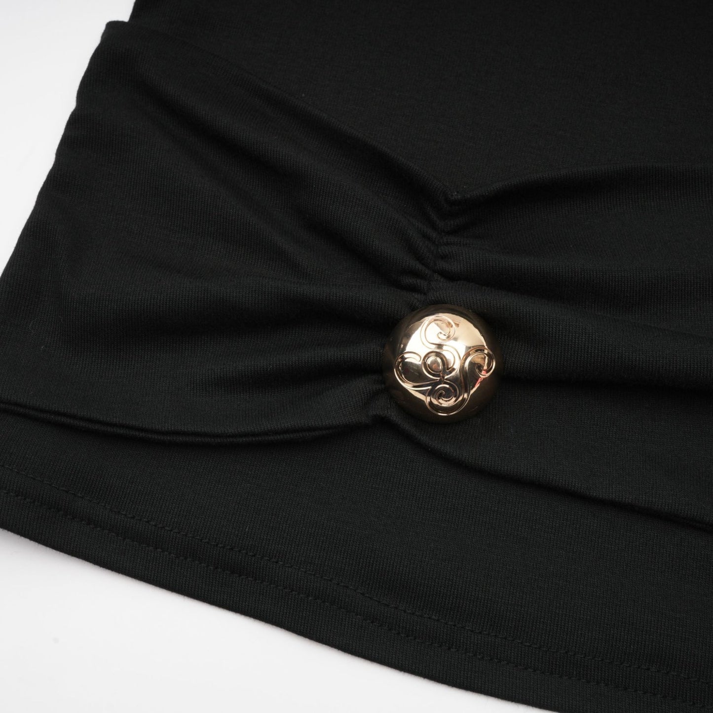 A black sleeveless top with ruched detailing made from stretchy jersey fabric
