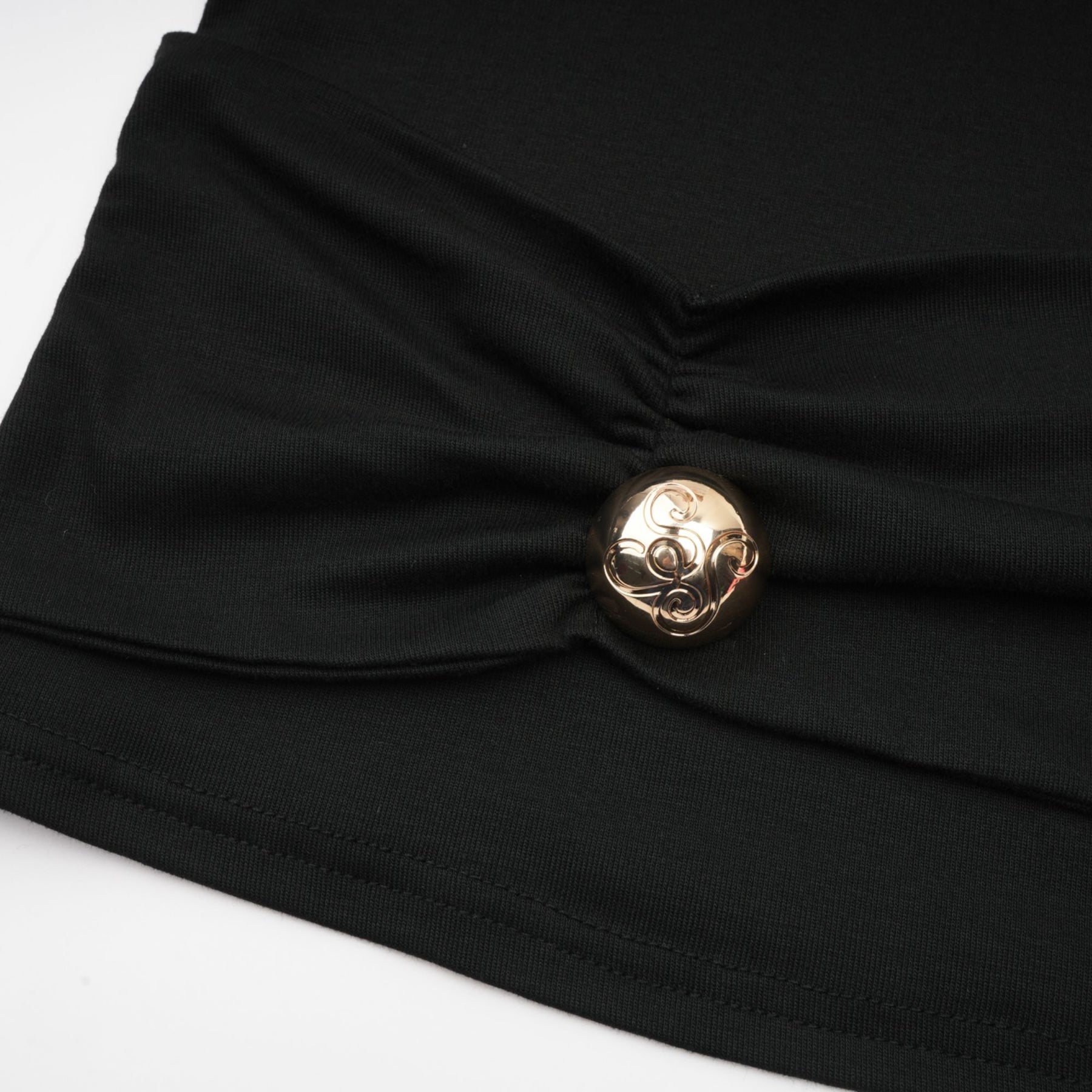 A black sleeveless top with ruched detailing made from stretchy jersey fabric