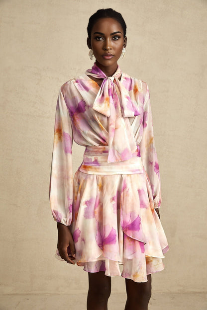 A short floral print mini dress with a V neckline in the Maelys style