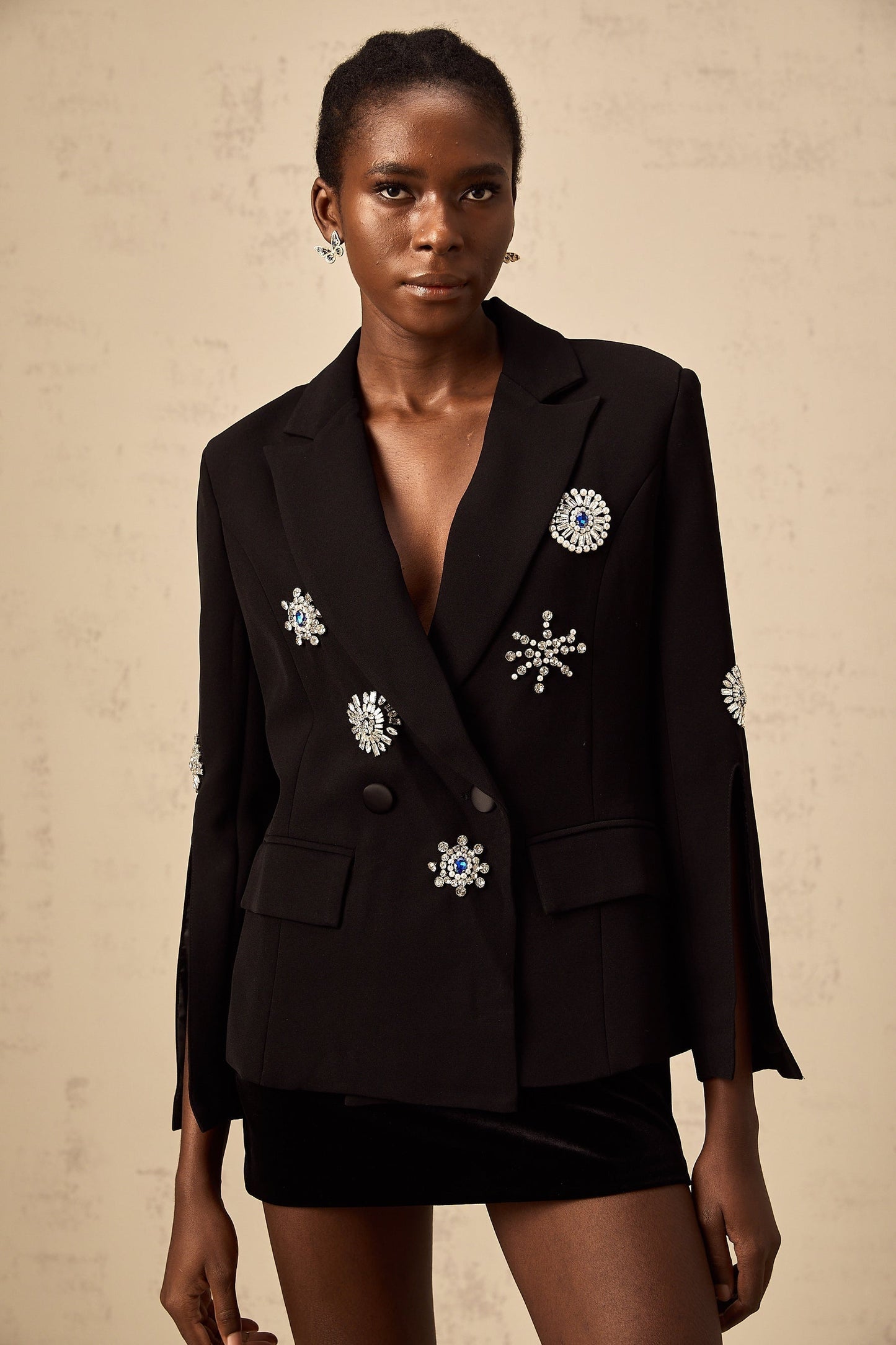 Black blazer with crystal embellishments and slit cuffs