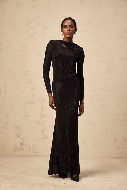 A long black maxi dress with ruched mesh fabric and rhinestone embellishments
