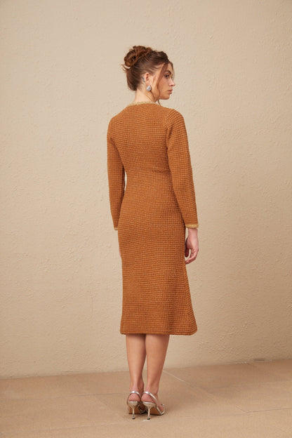 A brown tweed dress with braided edges and a fitted silhouette named Epona