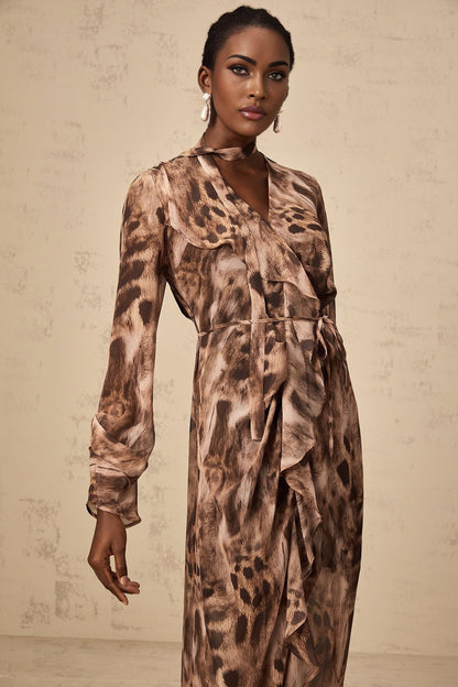 A brown midi dress with ruffled details and a leopard print pattern throughout
