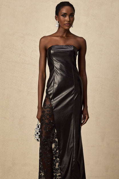 A long black dress with a faux leather body and lace panels featuring a maxi length silhouette