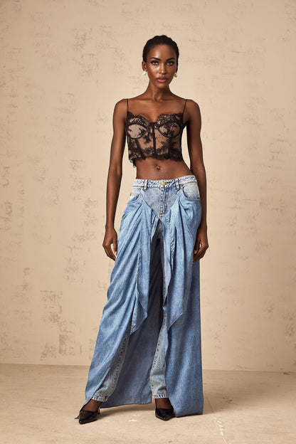 Woman wearing blue layered denim jeans styled with multiple tiers