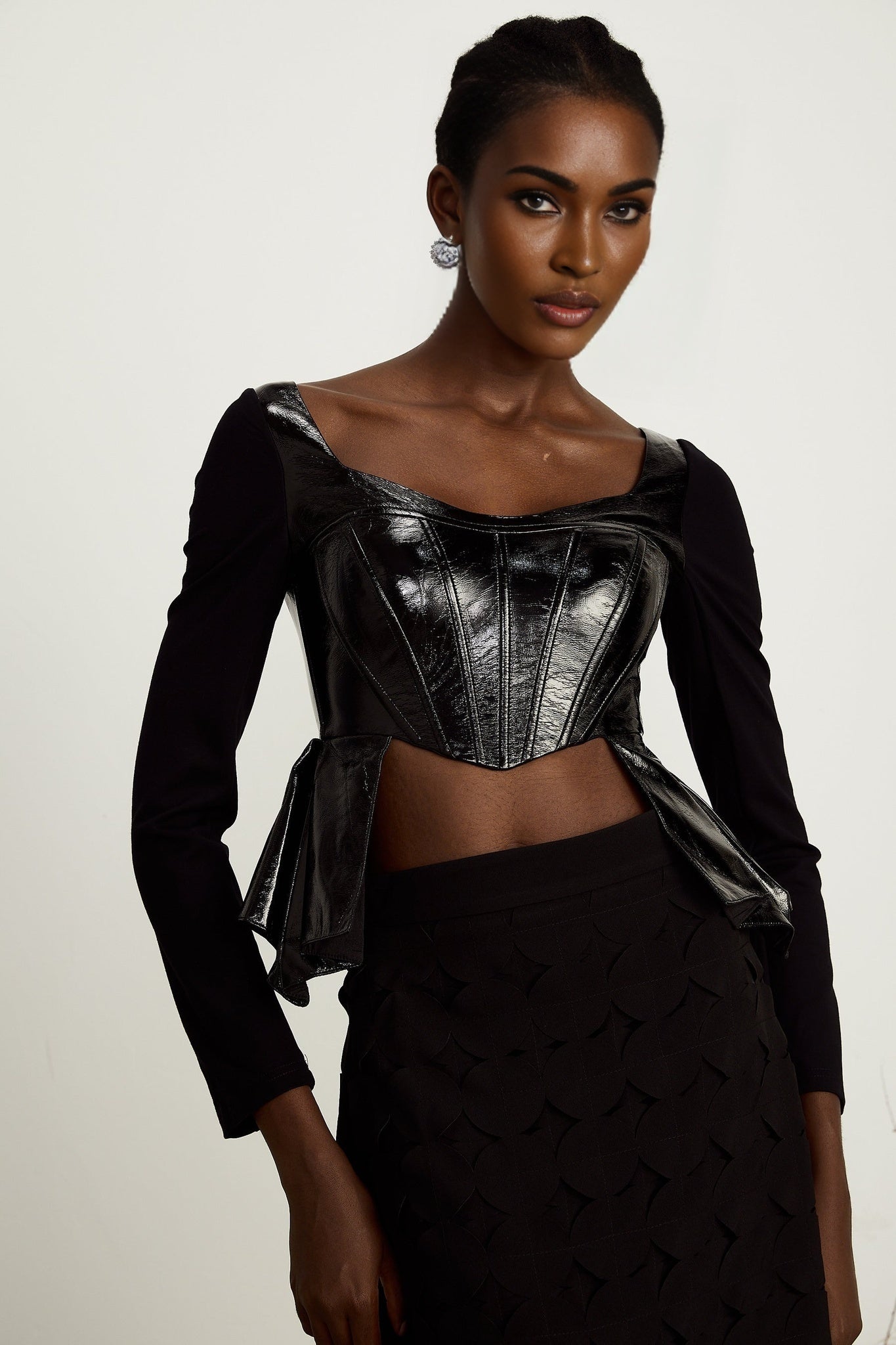 Jeannette fauxleather peplum panelled top