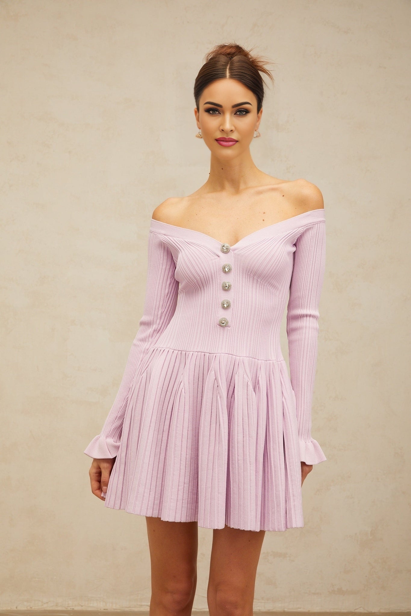 A light purple mini dress with an offshoulder neckline and ribbed knit texture