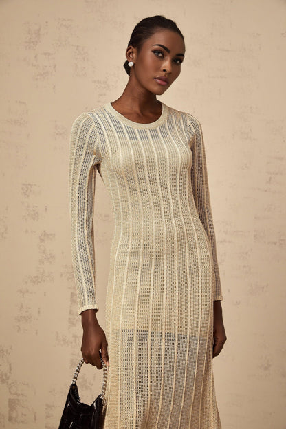 Woman wearing a sleek khaki knit midi dress with a fitted silhouette standing against a plain background
