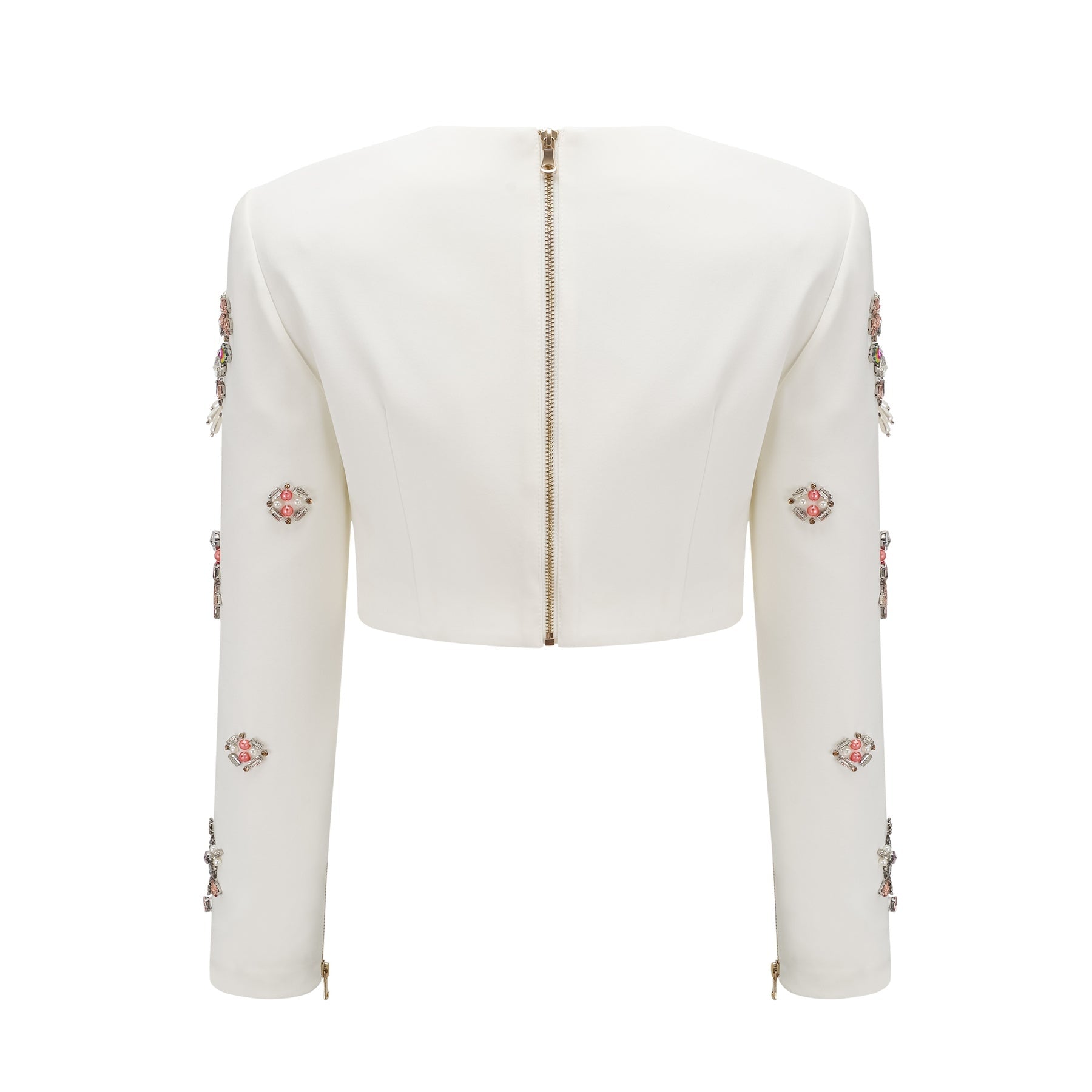 A white matching set consisting of a top and skirt adorned with crystal embellishments named Jeanne The outfit features a sleeveless top and a fitted skirt both decorated with sparkling crystals creating an elegant and sophisticated look