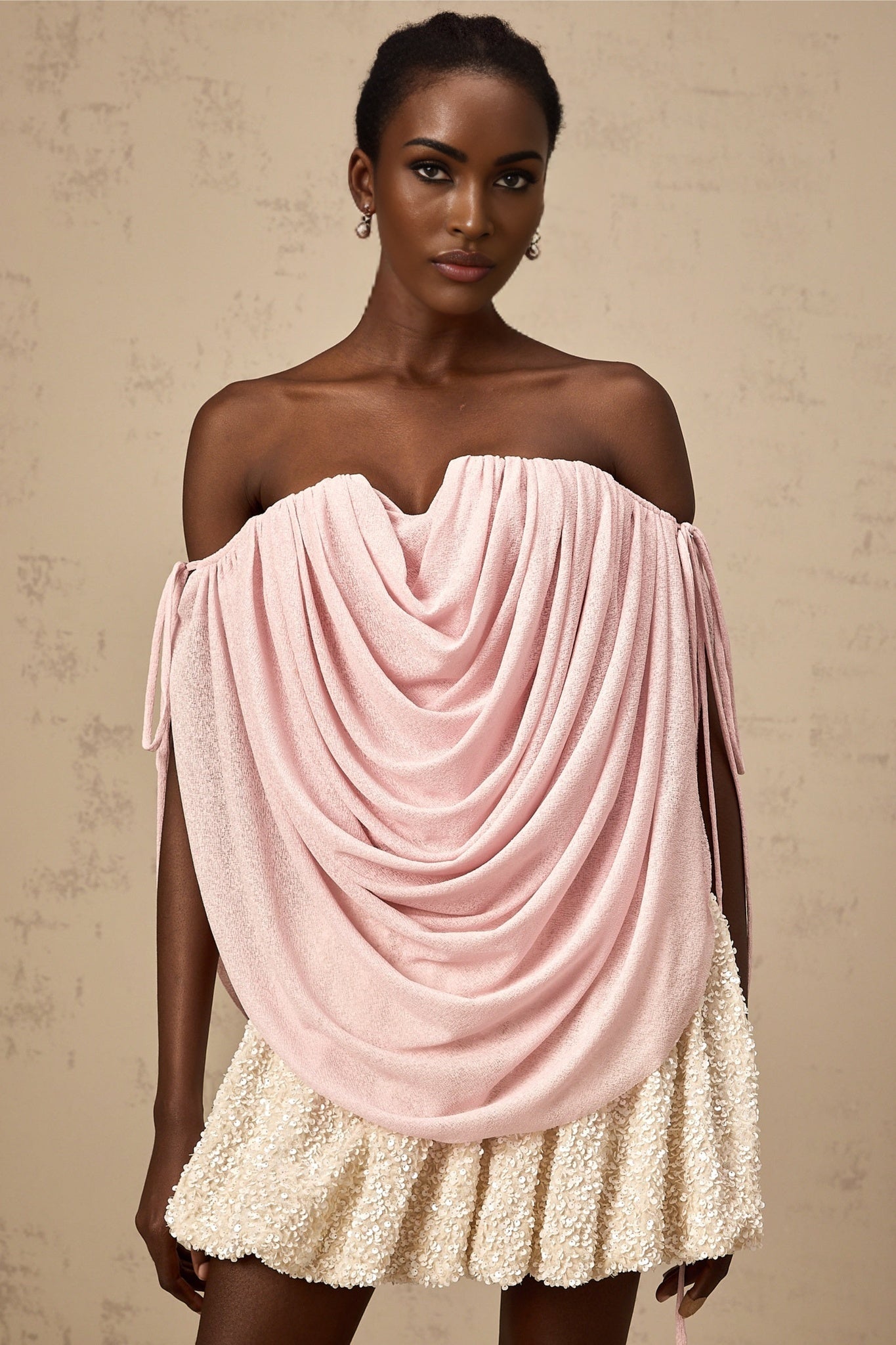 A pink offshoulder top with ruched detailing called Quintina