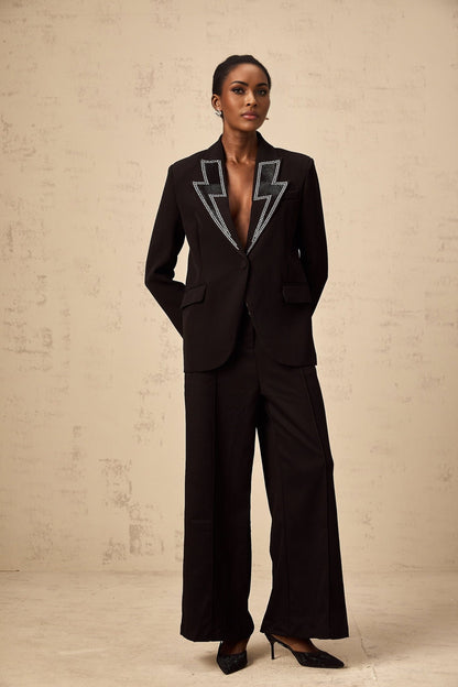 Black blazer with crystal embellishments in lightning pattern designed by Violeta