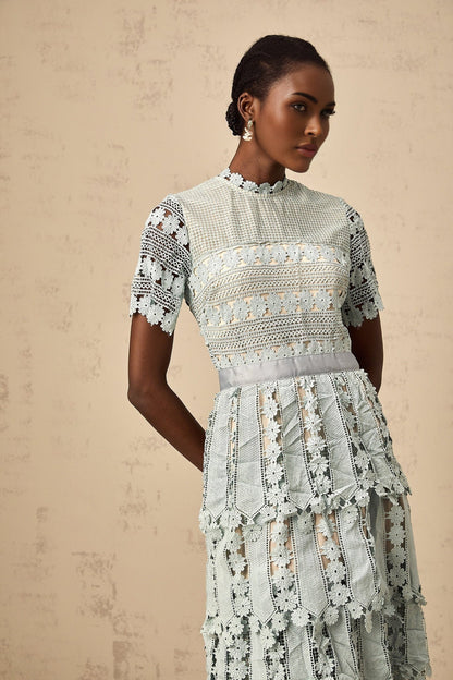 A green midi dress with floral embroidery details featuring an Oceane design