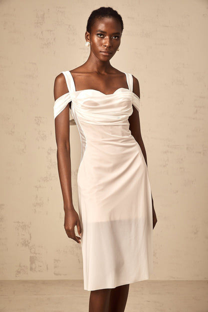 A white semi sheer midi dress with ruched detailing named Gloria