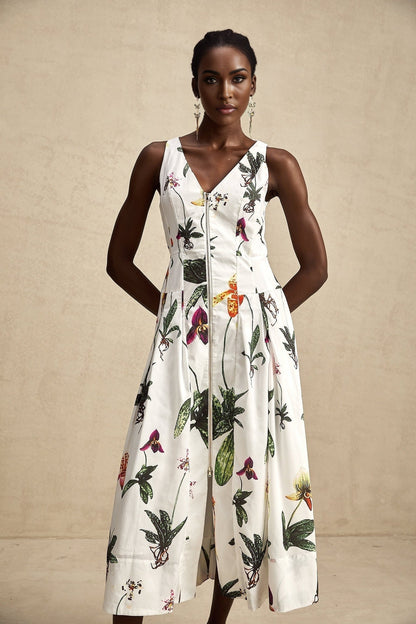 A floral print midi dress with a vneck made from poplin fabric featuring the Magali design