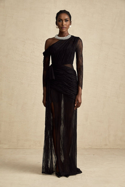 A black floorlength maxi dress with a single shoulder strap and a cutout detail on one side