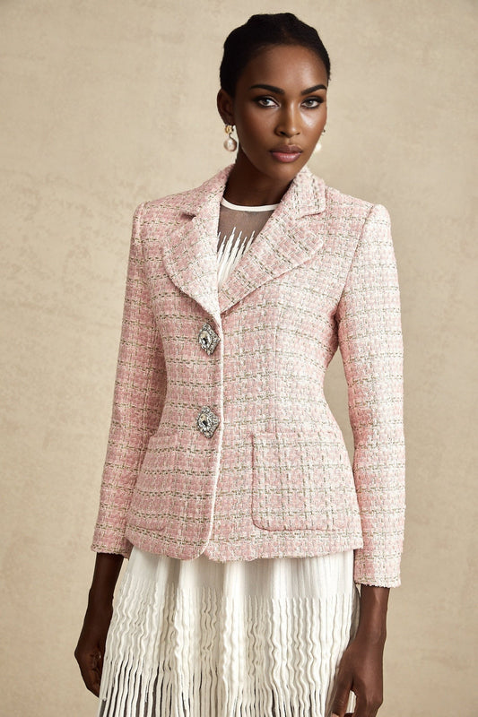 Woman wearing pink crystal embellished tweed blazer with check pattern