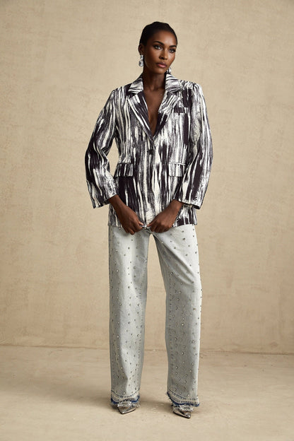 Black jacket with graffiti print design and textured fabric named Elise