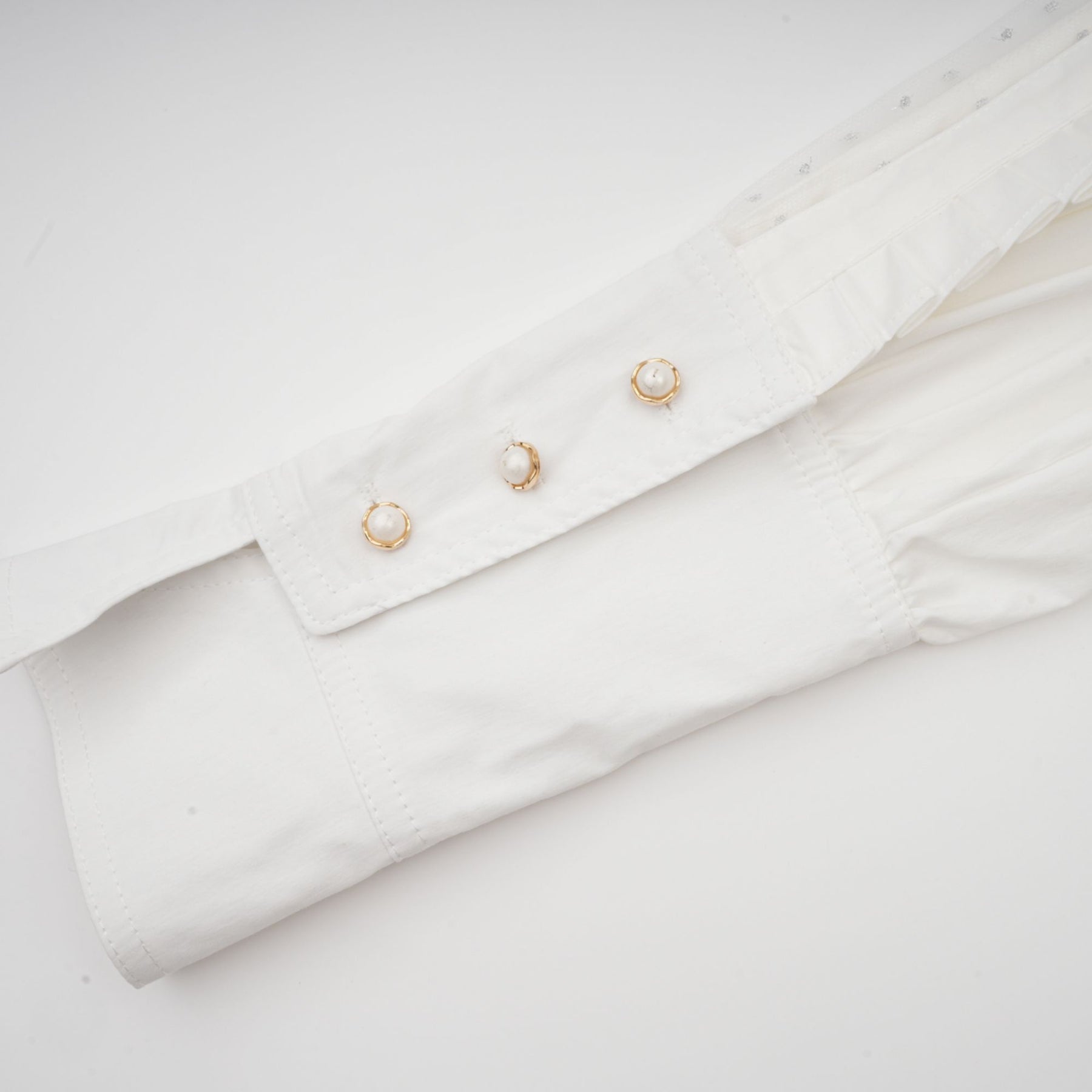 Céleste white pleated scarfcollar shirt