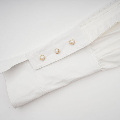 Céleste white pleated scarfcollar shirt