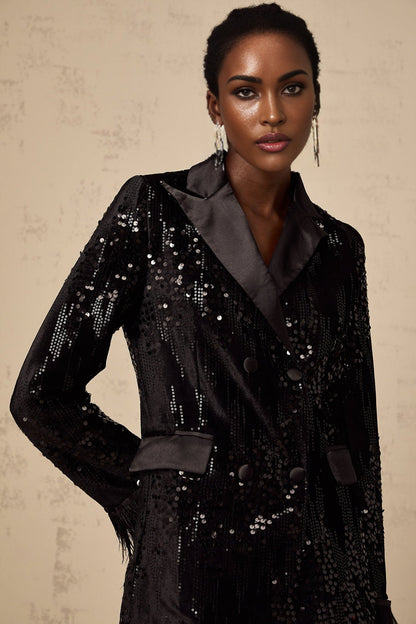 A black blazer with feather trim and sequin embellishments