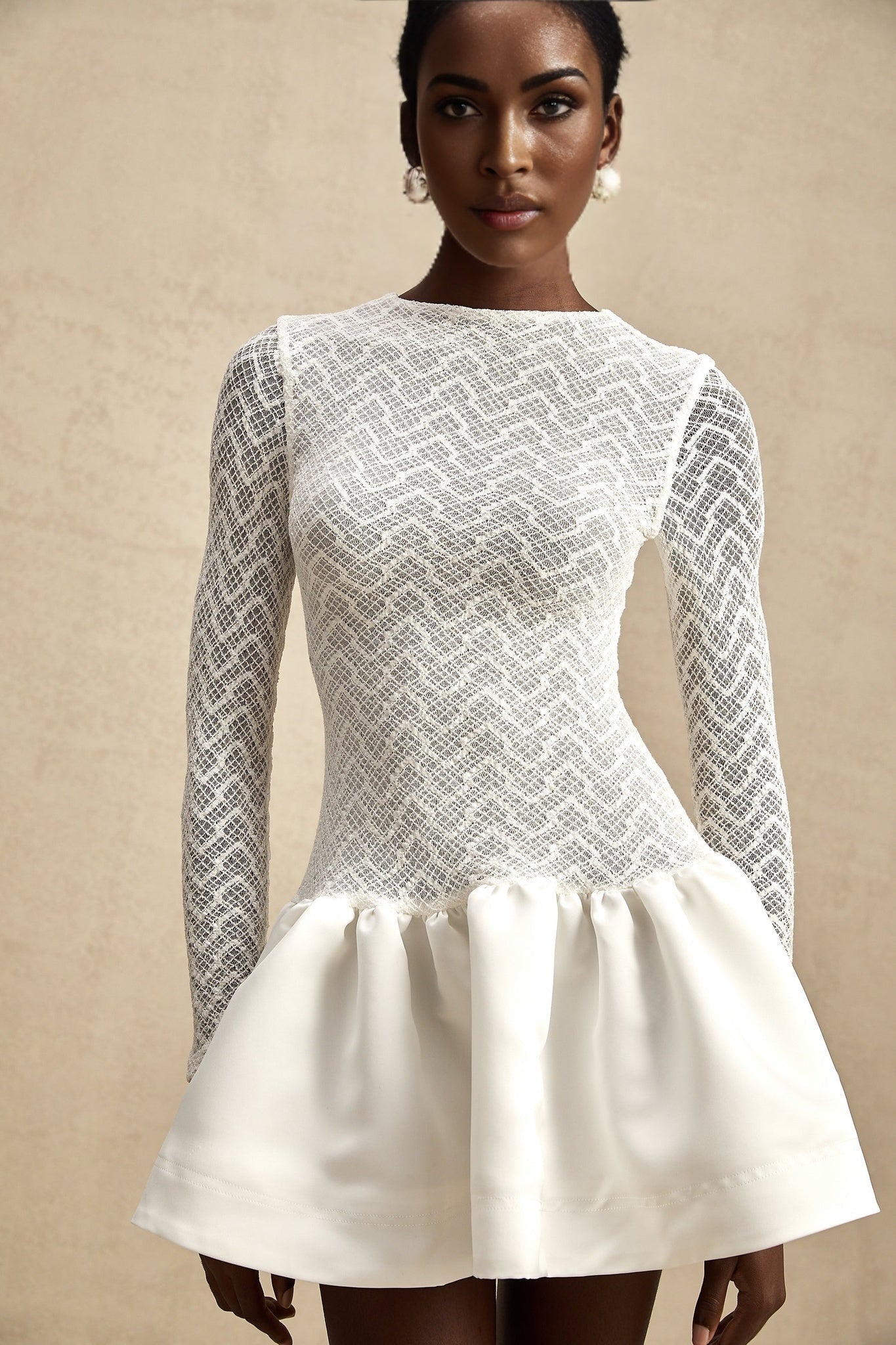 White lace mini dress with panelled design and short length called Oceane