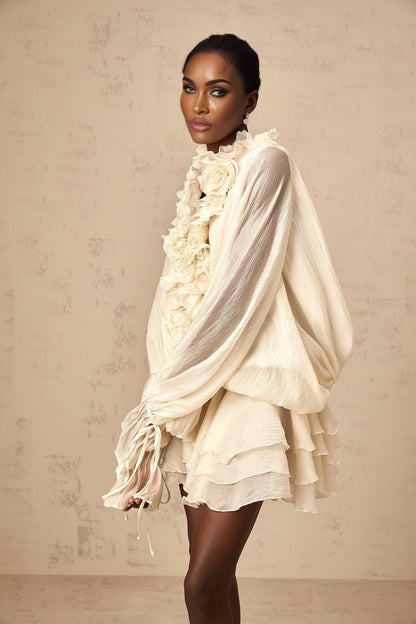 Tiered mini dress in neutral tones with floral applique details named Zephyrine