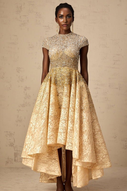 A woman wearing a neutral colored sequined dress with a high low hemline
