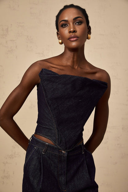 Woman wearing dark blue off shoulder denim top