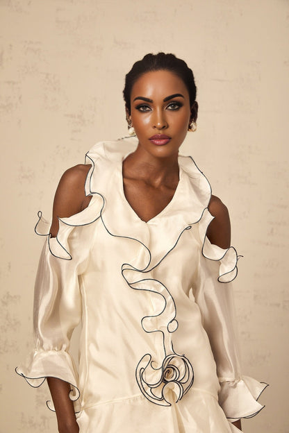 A white mini dress with a flounce design and ribbon details named Tiphaine