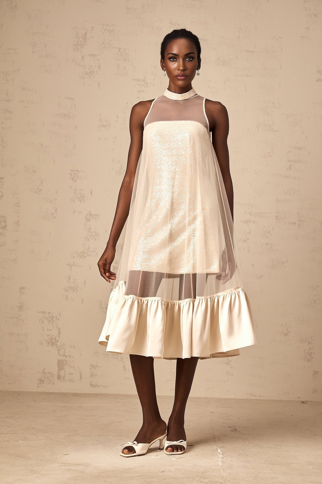A layered midi dress with a tulle panel and sequin embellishments named Josette
