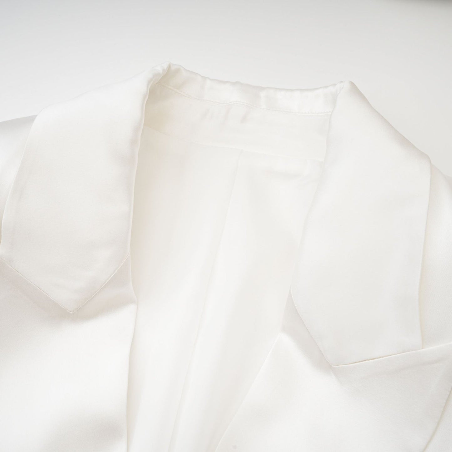 White double breasted blazer named Sylvie worn by model against plain background