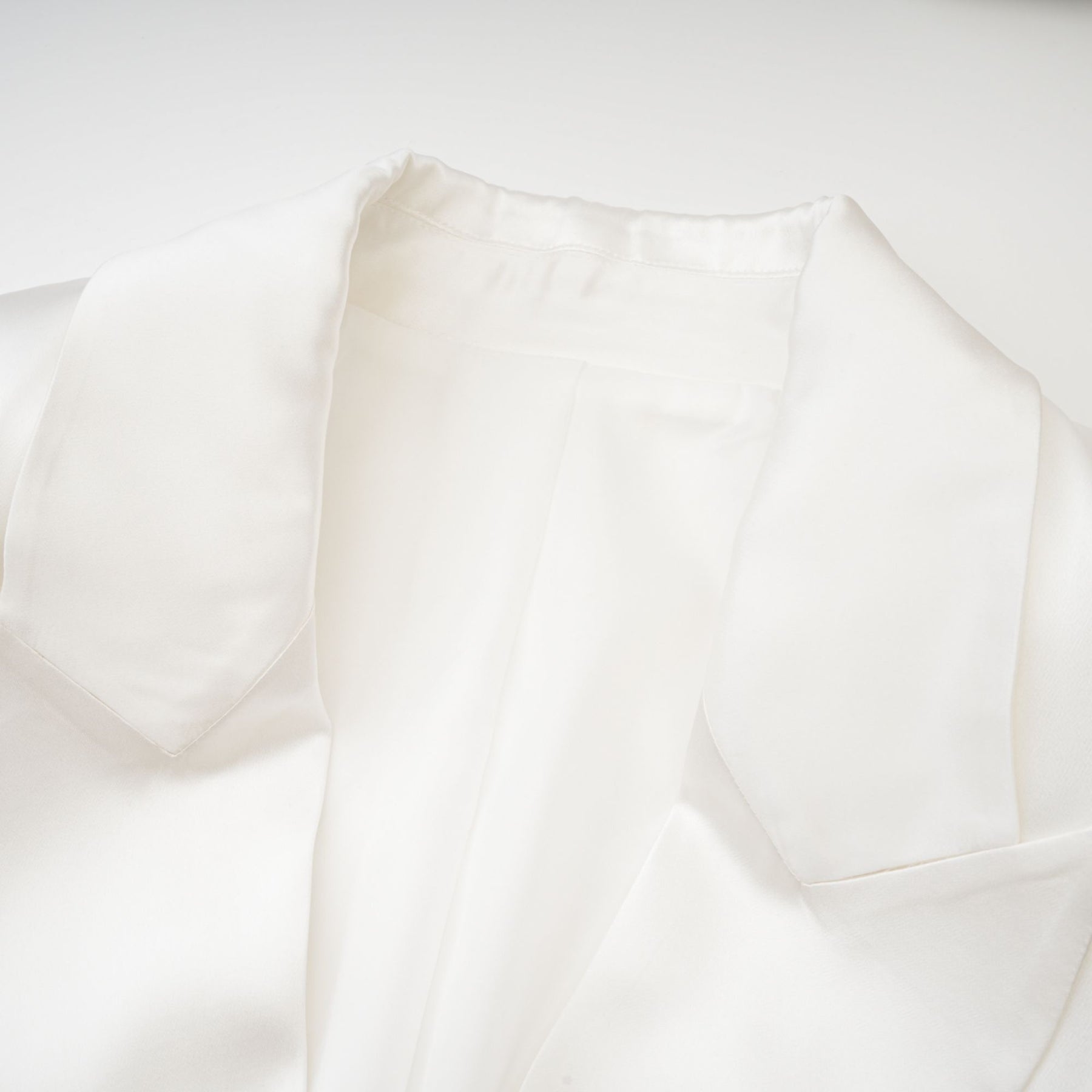 White double breasted blazer named Sylvie worn by model against plain background