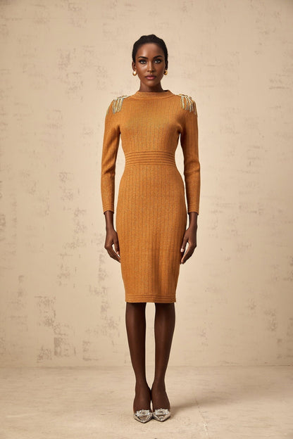 Woman wearing a navy blue ribbed knit midi dress with epaulet details on the shoulders