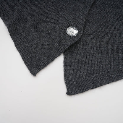 A grey cardigan with a butterfly design made of sequins featuring the Anastasie brand