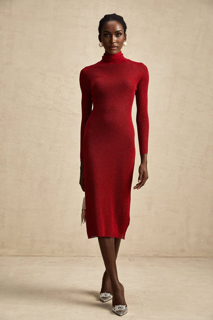 A red metallic midi dress with a pointelle knit pattern featuring a fitted silhouette and shimmering fabric