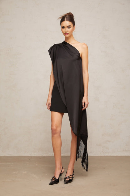 Woman wearing black one shoulder mini dress for Valentines Day occasion