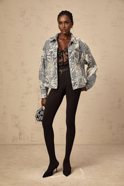 Woman wearing blue denim jacket with sequined flower embroidery design