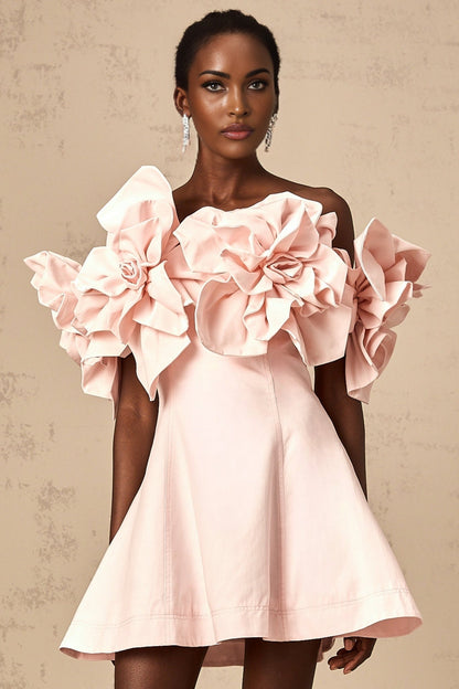A pink mini dress with an offshoulder neckline featuring three dimensional floral petal details along the bodice named Juliette