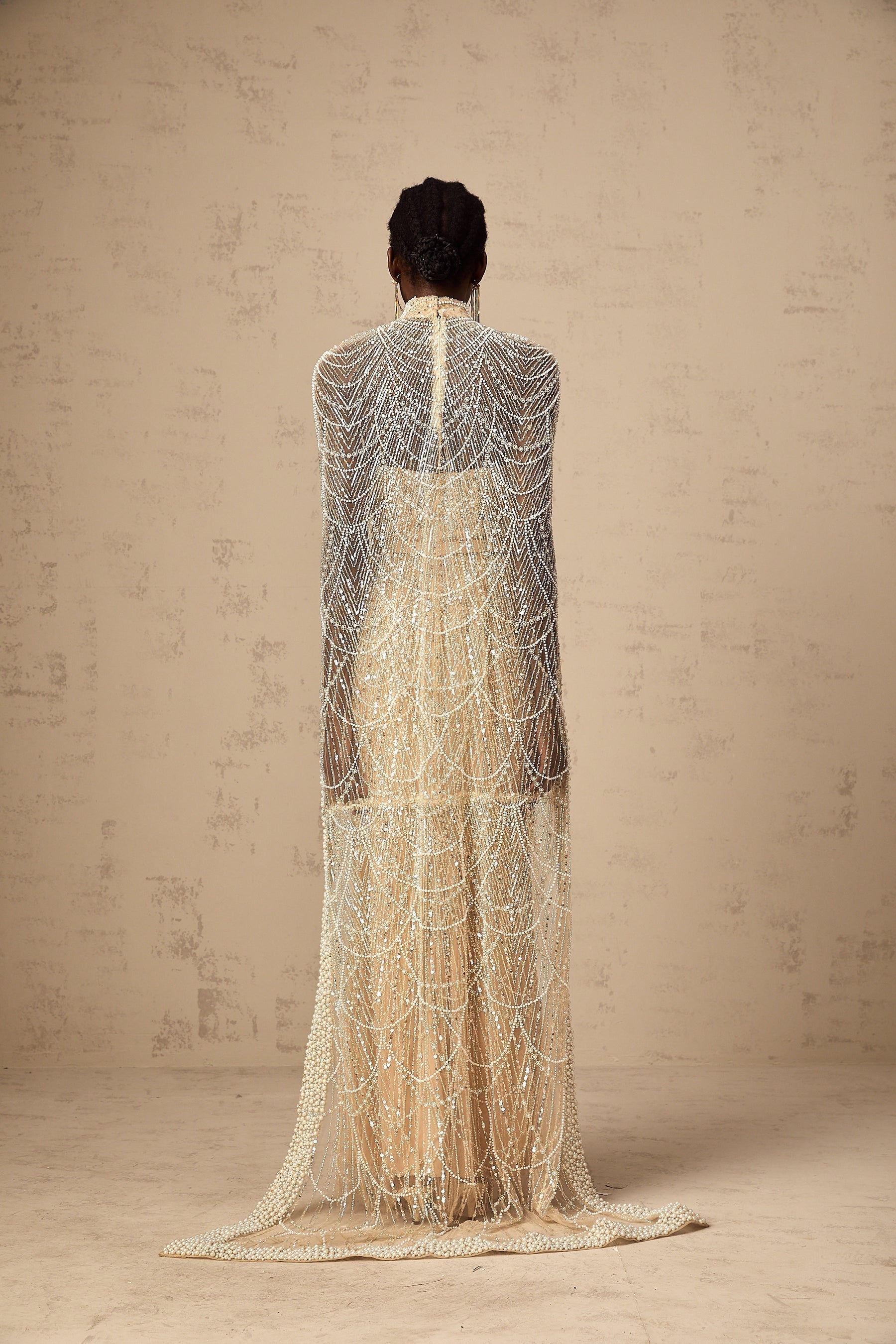 Elegant champagne colored gown with matching beaded cape Frederica set
