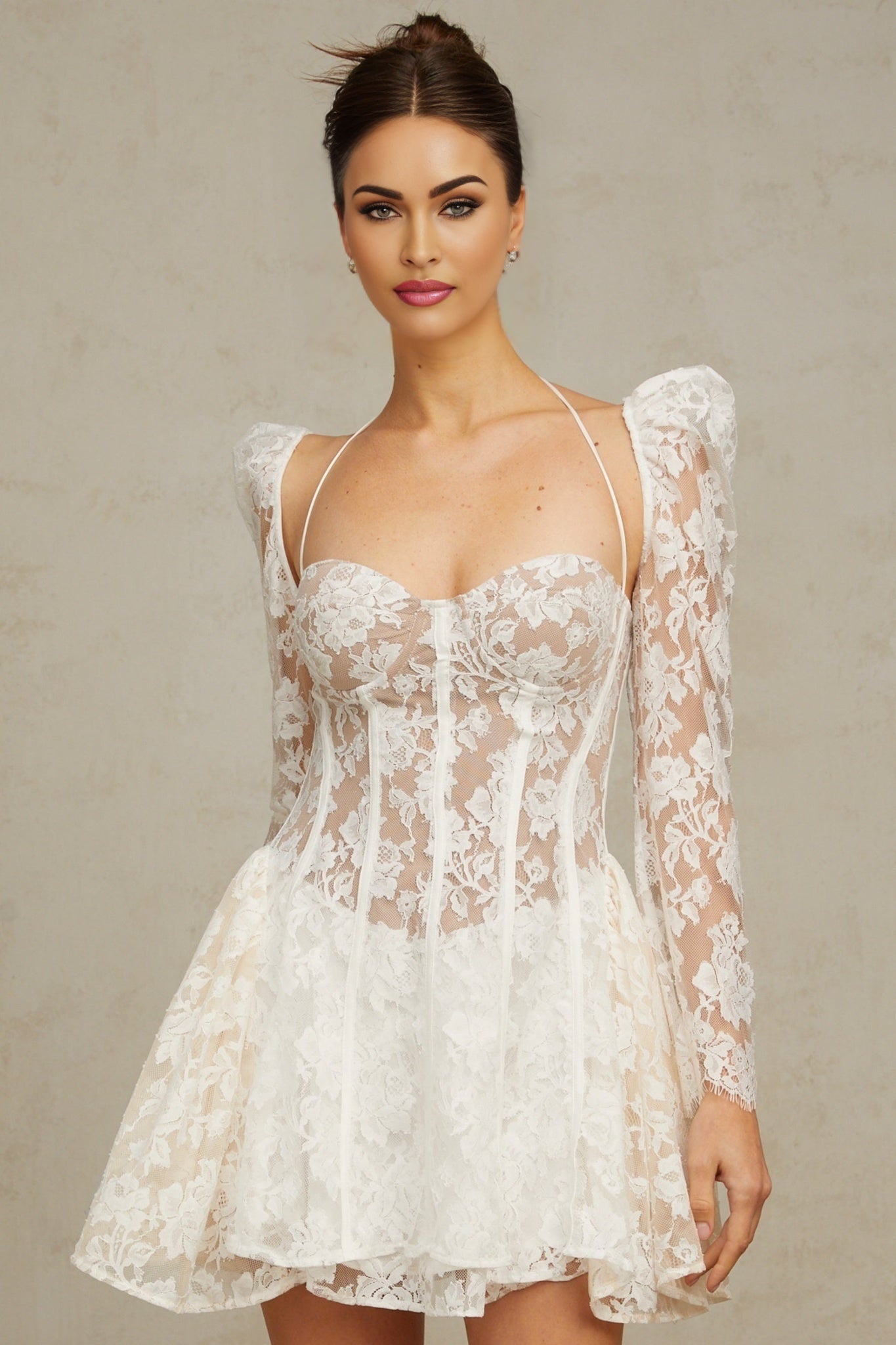 Vivienne white mini dress with floral lace pattern and corset style bodice on a plain background