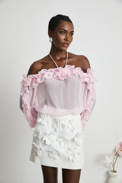 Sleeveless pink semi sheer top with a straight neckline